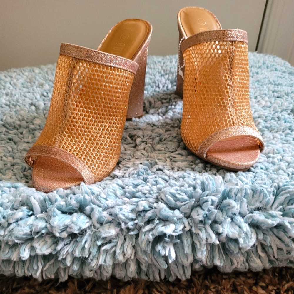 A pair of open toe slide on shoes  size 8